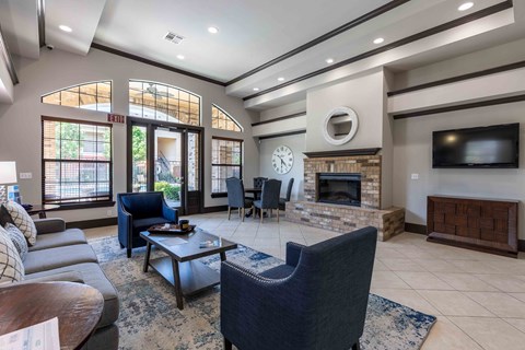 a living room with a fireplace and a television